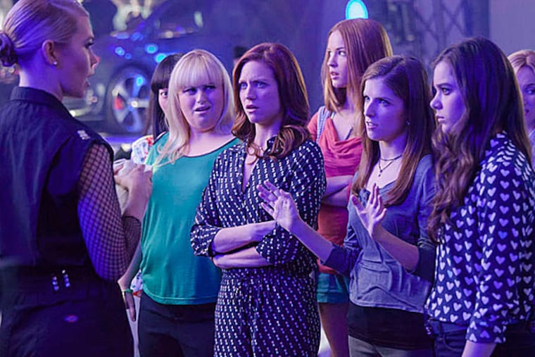 Kommissar (Birgitte Hjort Sorensen) throws shade at the Barden Bellas' Lilly (Hana Mae Lee), Fat Amy (Rebel Wilson), Chloe (Brittany Snow), Stacie (Alexis Knapp), Beca (Anna Kendrick), Emily (Hailee Steinfeld), Jessica (Kelley Alice Jakle) and Flo (Chrissie Fit) in "Pitch Perfect 2." (Photo courtesy Universal Pictures/TNS)