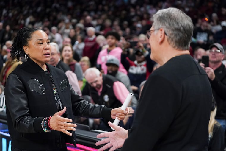 South Carolina's Dawn Staley and UConn's Geno Auriemma meet before a game on Feb. 16, 2025.