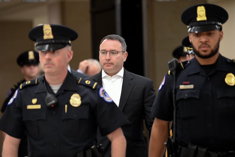 Former National Security Council Director for European Affairs Lt. Col. Alexander Vindman, center, leaves after reviewing his testimony in a closed-door interview on Capitol Hill in Washington, Thursday, Nov. 7, 2019, in the impeachment inquiry on President Donald Trump's efforts to press Ukraine to investigate his political rival, Joe Biden.