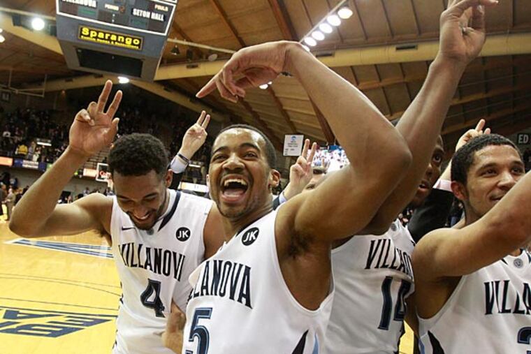 Darrun Hilliard (left) and Phil Booth celebrate after their victory. (Charles Fox/Staff Photographer)
