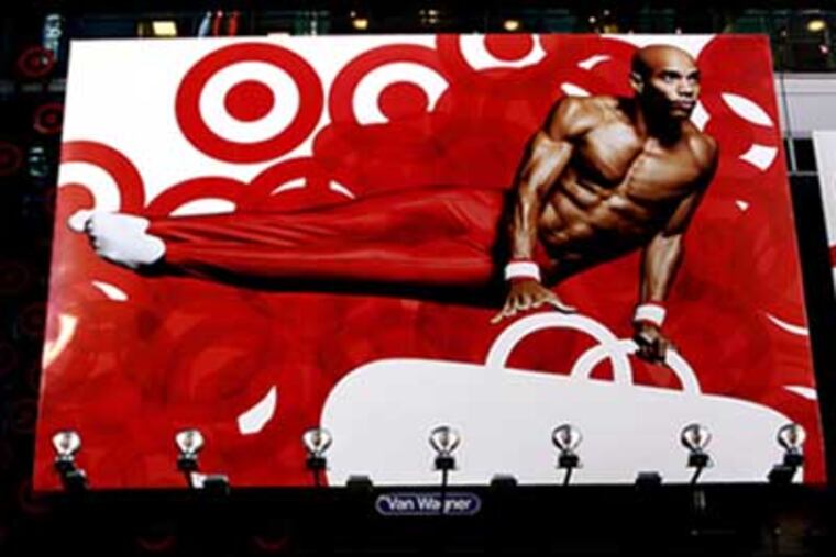 Ray Armstrong appeared on a Times Square advertising billboard (top) during the 2008 Olympics.