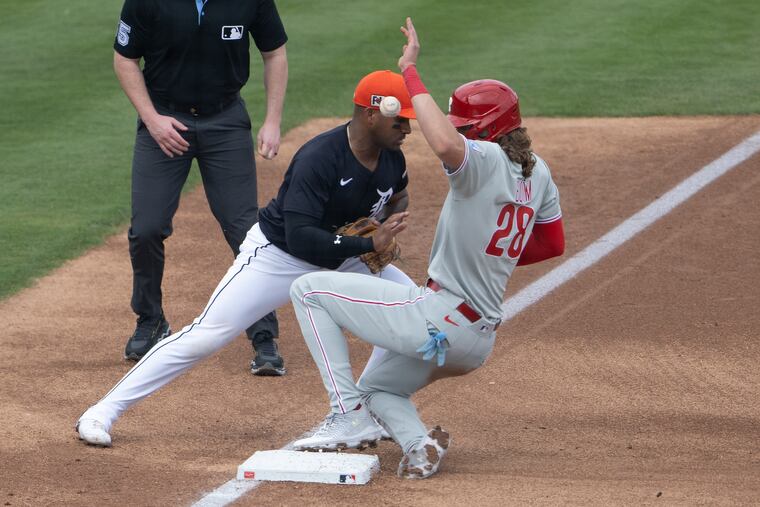 Phillies’ Alec Bohm slides safe on third base against the Detroit Tigers, Andy Ibañes, during the firs inning on Saturday. The Tigers would hit a walk-off to take the first game of spring.