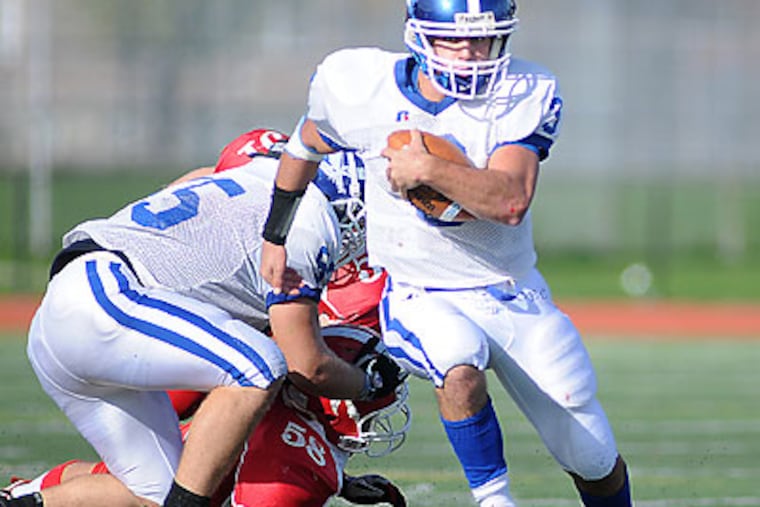 Conwell Egan's Anthony Singlar takes off on a run late in the fourth quarter. (Kriston Bethel/Staff Photographer)