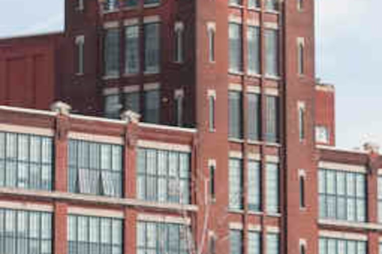 Damaged windows in the Victor Lofts building in Camden should be replaced by the end of the year, the contractor said.