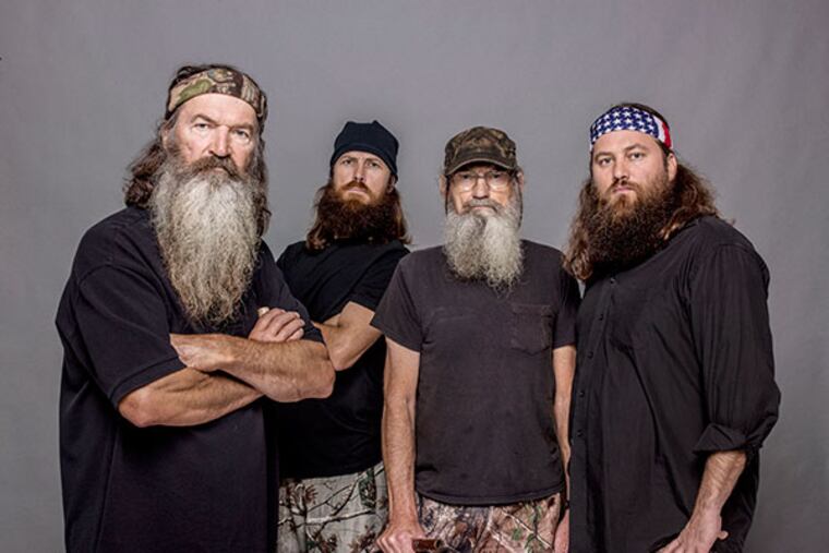 From left, Phil Robertson, Jase Robertson, Si Robertson and Willie Robertson from the A&E series, "Duck Dynasty." The A&E channel says "Duck Dynasty" patriarch Phil Robertson is off the show indefinitely after condemning gays as sinners in a magazine interview. (AP Photo/A&E, Zach Dilgard)