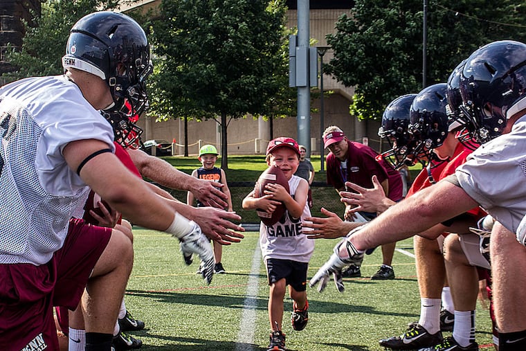 Penn junior captain Vhito DeCapria, center, seen here in 2018, when he was initially declared cancer-free, succumbed to the disease earlier this year. He was 14.