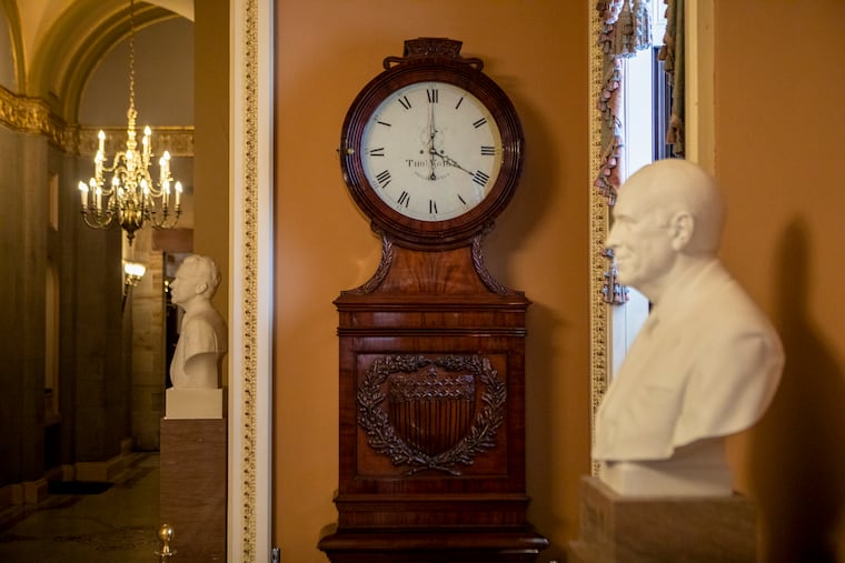 FILE — A clock in a hallway of the U.S. Capitol in Washington, March 9, 2023. The House on Tuesday, July 14, 2026, voted overwhelmingly to make daylight saving time permanent, but the measure to spare Americans the semiannual clock-changing that shortens winter days faces an uncertain path to enactment.