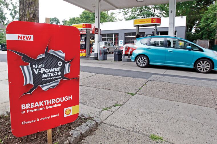 Shell station on Germantown Ave in Chestnut Hill advertising the new V-Power Nitro+ gasoline at their station while someone fills up their car. ( Michael Bryant / Staff Photographer )