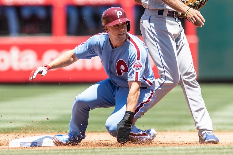 Phillies, Scott Kingery, looks back after getting tagged out on second base by New York Mets, Jeff McNeil, (6) in the first inning of the game, Thursday, June 27, 2019 at Citizens Bank Park in Philadelphia, PA.