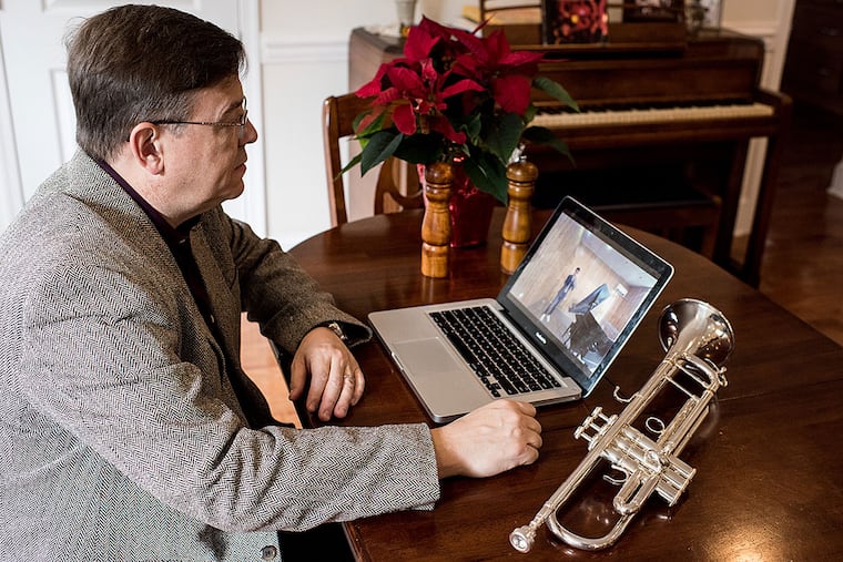 David Bilger, principal trumpeter of the Philadelphia Orchestra, at his home. David critiques and teaches Ahmadbaset Azizi, 17, who lives in Kabul, Afghanistan.