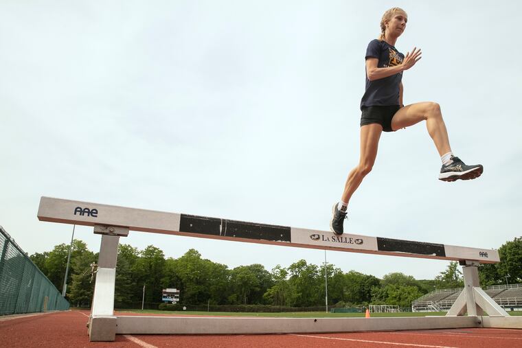 Grace Mancini hurdles while training at La Salle’s McCarthy Stadium.