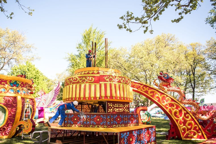 The Chinese lantern artisans get the base of the "Dancing Fairy" ready for its next two layers, which will make the display 50-feet-tall.