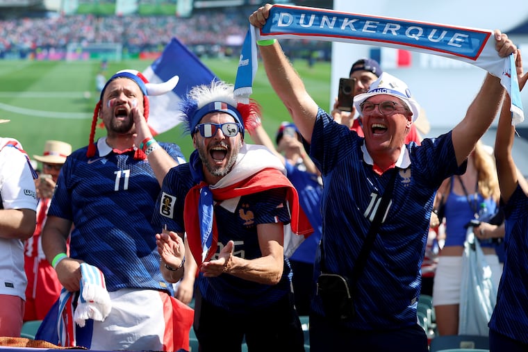 French fans cheer for their team in their match against Paraguay during the World Cup Round of 16 game in Philadelphia on Saturday.