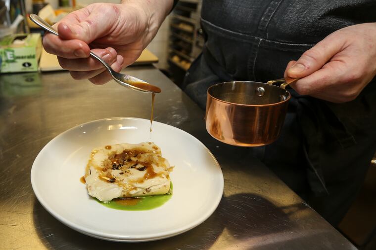 Chef-owner Mike Jenkins prepares crepes Michelle, a dish inspired by his mother, at Keep in Jenkintown.