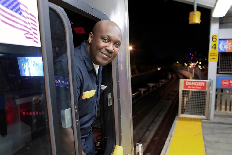 Train engineer Maurice Bey poses for a photo during the first night of SEPTA's late night subway service in Philadelphia, Saturday June 14, 2014. (For the Daily News/ Joseph Kaczmarek)