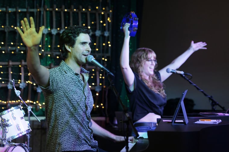 Devin and Mary Calderin perform their dueling piano act, Love Me Duel, at Troubles End Brewing in Collegeville last month.