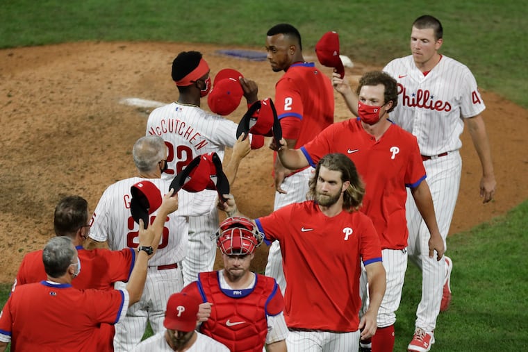 The Phillies celebrate their 13-8 win over the Atlanta Braves on Monday, August 10, 2020 in Philadelphia.