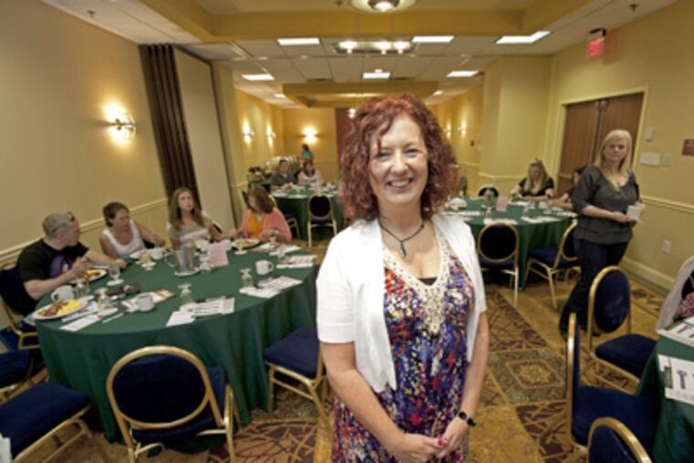 Kelly Master founded Dining for Dignity in 2011. At its monthly breakfast meetings, members discuss human trafficking. (April Saul / Staff Photographer)