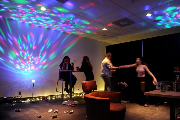 Rutgers-Camden students acting in a skit: Samantha Buchner (right), 19, is forced into another room by Arpreet Singh, 21, during a party scene in the "Tunnel of Oppression" on campus.