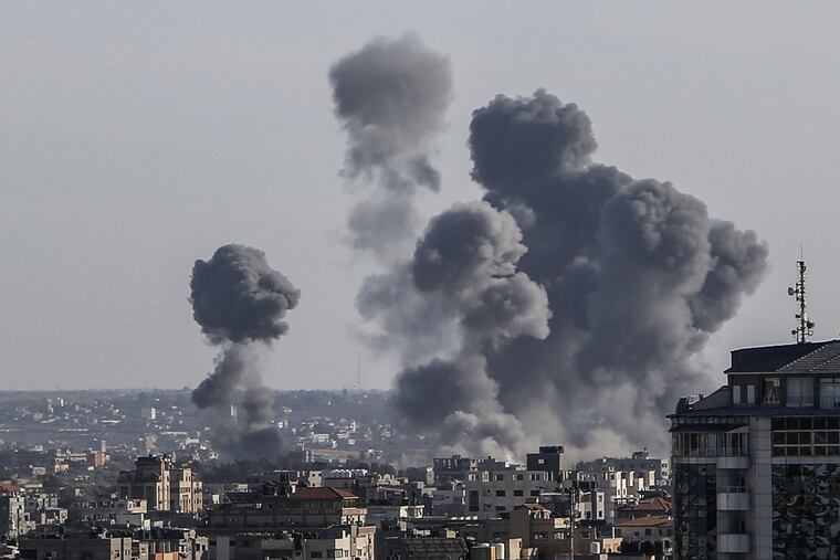 Smoke rises from buildings after Israeli air strikes in Gaza City on Saturday, May 4, 2019. Palestinian militants launched about 200 rockets and mortars into southern Israel from Gaza on Saturday, and the Israeli military responded with airstrikes and tank fire against targets across the Palestinian coastal territory.