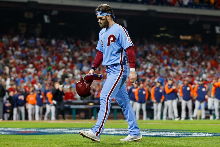Philadelphia Phillies designated hitter Bryce Harper leaves the field after Philadelphia Phillies right fielder Nick Castellanos grounds out to end World Series Game 5.