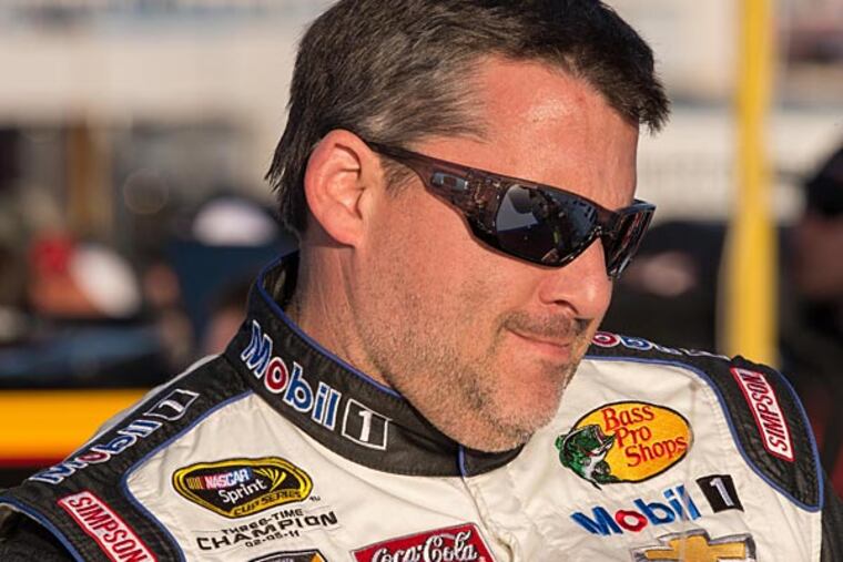 Sprint Cup Series driver Tony Stewart (14) looks on during qualifying for the Kobalt 400 at Las Vegas Motor Speedway. (Jerome Miron/USA Today)
