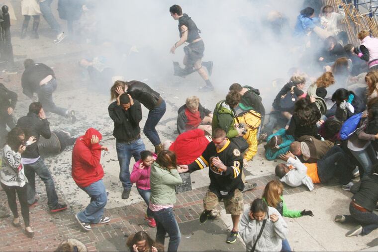 This Monday April 15, 2013 photo provided by Ben Thorndike shows the scene following an explosion at the 2013 Boston Marathon in Boston. (AP Photo/Ben Thorndike)