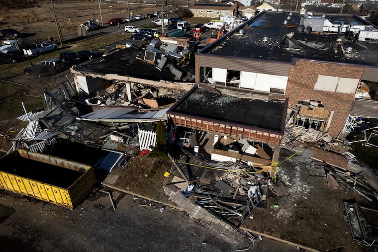 Investigators work to clear the scene at Bristol Health & Rehab Center on Wednesday, Dec. 24, 202, where two people were killed one day earlier.