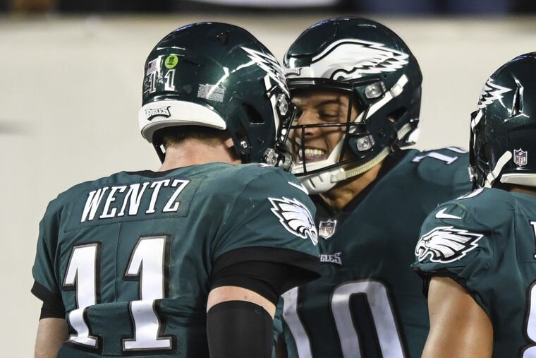 Philadelphia Eagles quarterback Carson Wentz and wide receiver Mack Hollins celebrate the touchdown pass the connected on in the 2nd quarter of the game against the Washington Redskins at Lincoln Financial Field October 23, 2017. CLEM MURRAY / Staff Photographer
