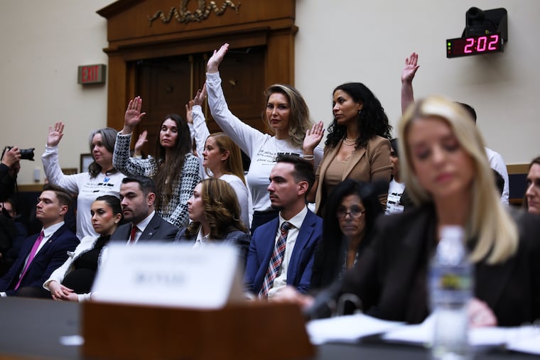 During a House Judiciary Committee oversight hearing on Capitol Hill in Washington on Feb. 11, Rep. Pramila Jayapal (not pictured) asked the Jeffrey Epstein survivors present in the room to raise their hands if the U.S. Department of Justice — under Attorney General Pam Bondi (foreground, right) — had failed to meet with them.