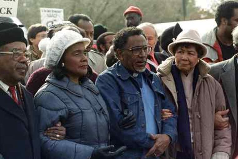 Benjamin L. Hooks (right) is joined by Coretta Scott King (second from left) and SCLC president Joseph Lowery (center) as they march to the Forsyth County, Ga., Courthouse in 1987.