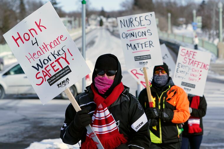 Nurses picketed Friday in Faribault, Minn., during a health-care worker protest of a shortage on protective masks.