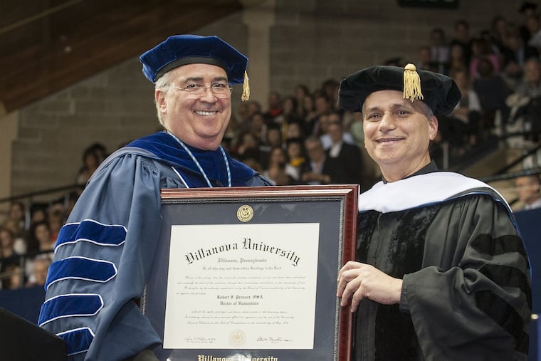 The Rev. Peter M. Donohue, president of Villanova University, presents an honorary doctorate to Bishop Robert Prevost at Villanova's 2014 commencement.