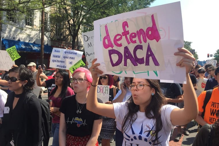 Pro-DACA demonstrators rally outside the Department of Justice offices at Second and Chestnut Streets on Tuesday morning.