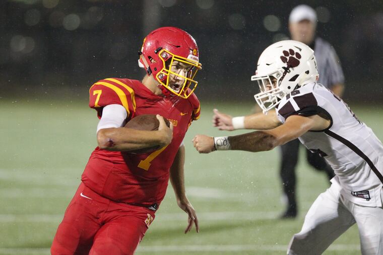 Jake Ruane, left, of Haverford tries to get away from Brandon DiCamillo of Garnet Valley during the 1s quarter at Haverford High on Sept. 7, 2018.