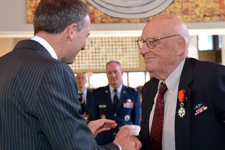 Kurt Deardorf (right) is presented with France's highest military medal, the Legion of Honour, by Olivier Sérot-Alméras, French consul general at the French Embassy in Washington, D.C. on March 26, 2014. ( Photo via The Embassy of France )