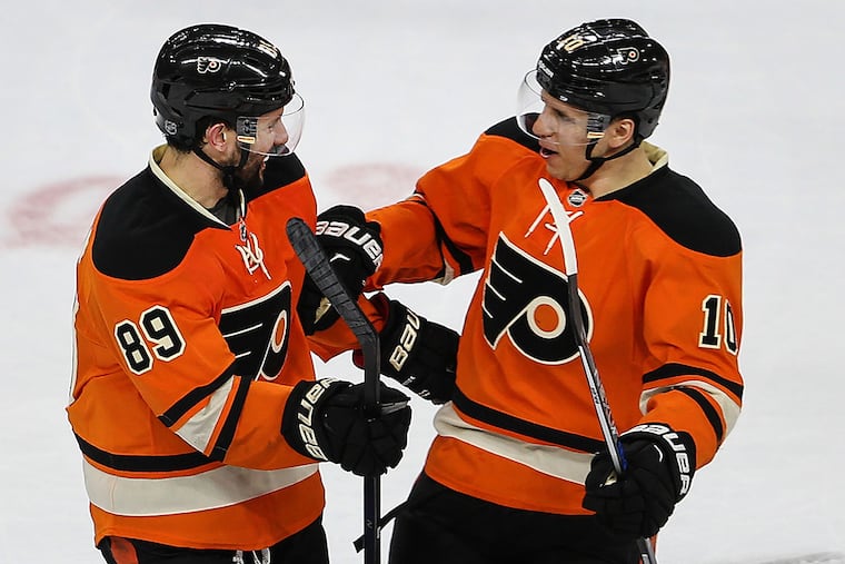 Sam Gagner celebrates his winning goal against the Capitals with teammate Brayden Schenn.