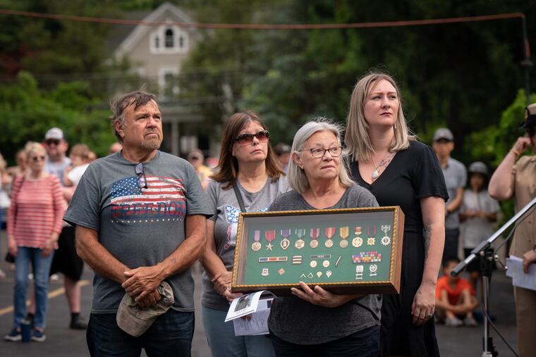 Bernice Schaffer holds a case of military medals and ribbons awarded in honor of her brother, Frank Mebs, at a ceremony Monday at the Jesse Soby American Legion Post No. 148 in Langhorne.