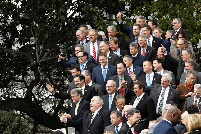 Republicans wave to President Donald Trump at an event to celebrate passage of the Tax Cuts and Jobs Act on Dec. 20. But when it comes to health care, there isn’t much to cheer about.