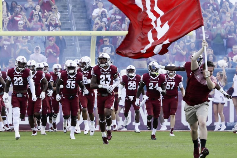 The Temple football team runs on the field before they played Villanova on Saturday, September 9, 2017 in Philadelphia.