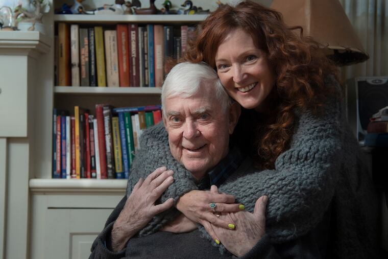 Rich Westcott with his youngest daughter, Amy Westcott, at the family's home in Springfield, Delaware County. Rich Westcott is a prominent Philly sports writer, author, and historian. His daughter, Amy Westcott is a successful costume designer for film and television. Her designs also will be featured in a TV commercial that will debut during the Super Bowl.