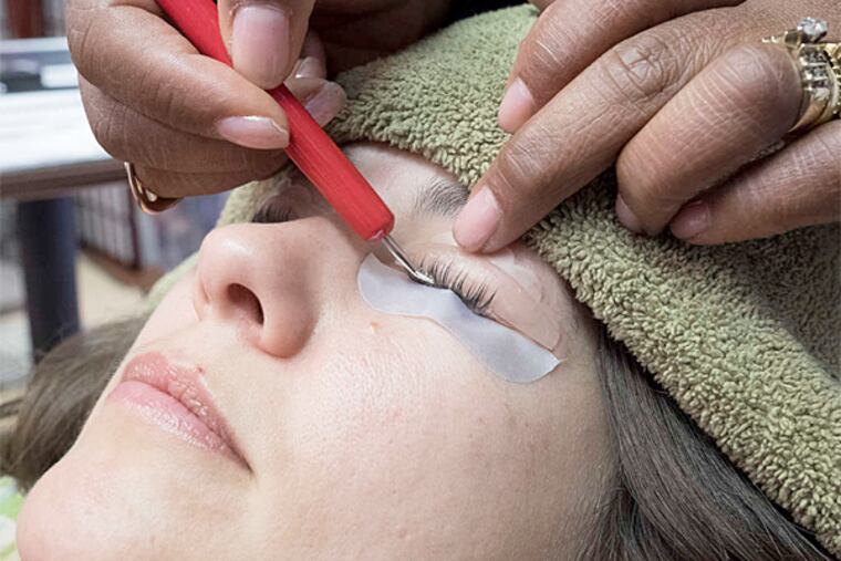 Anne Brody's natural lashes are lengthened, with a deep curl added. The process takes about 45 minutes, can cost $100 to $200, and lasts about two months, or until the natural lash grows out. Ursula's About Phace, 1700 Sansom St., Suite 201; 215-557-1562; www.aboutphace201.com. (Ed Hille / Staff Photographer)