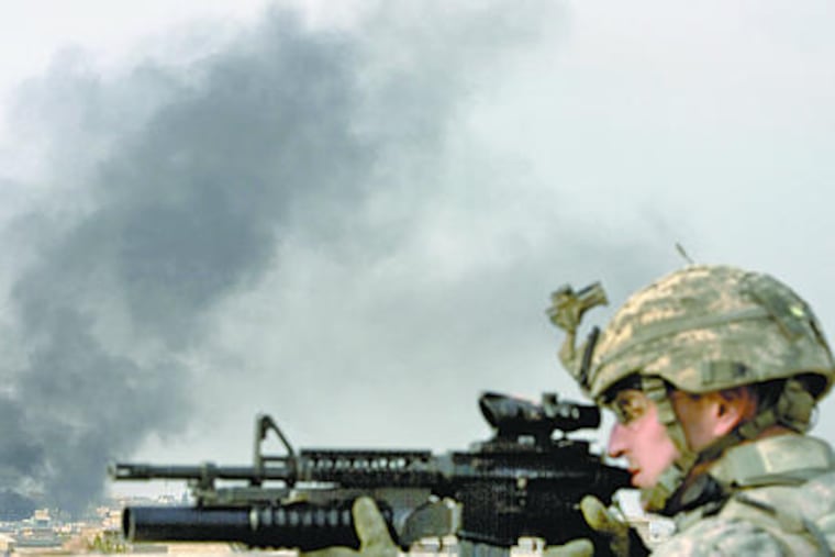 U.S. Army Staff Sgt. Brian Peterson on patrol. U.S. officials say the "security piece" in Mosul is moving ahead, but the politics and economy have failed to follow.