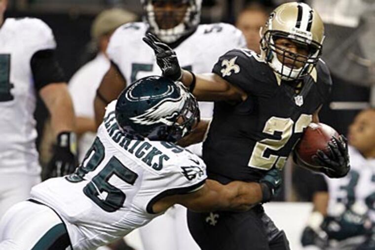 Eagles linebacker Mychal Kendricks gets shoved by the New Orleans Saints' Pierre Thomas. (Yong Kim/Staff Photographer)