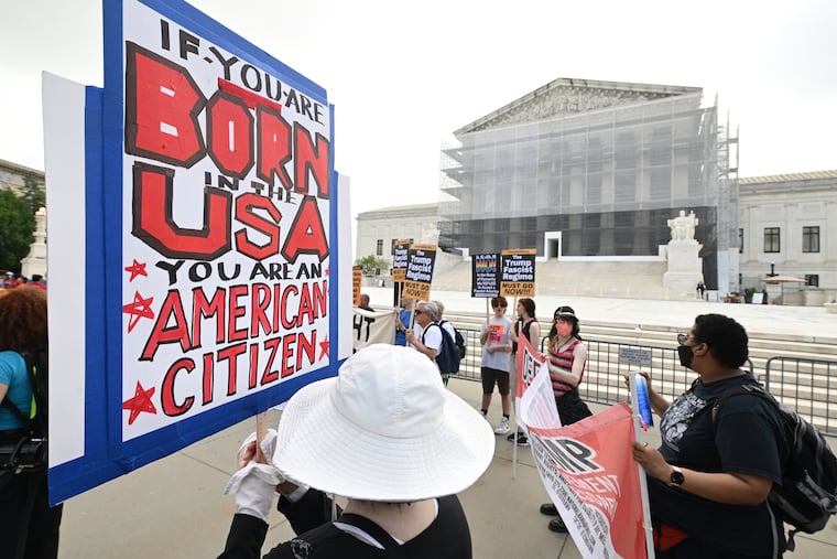 People demonstrate outside the Supreme Court on May 15 in Washington, D.C.