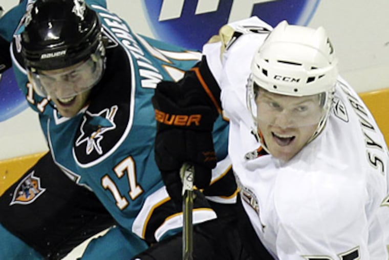 Danny Syvret, right, returns to the Flyers as part of a four-player trade with the Anaheim Ducks. (AP Photo/Marcio Jose Sanchez)