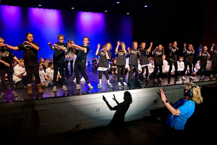 Caroll Stoner at a dress rehearsal with students for the Elizabeth Haddon Elementary School Talent Show that she has been directing for 18 years.