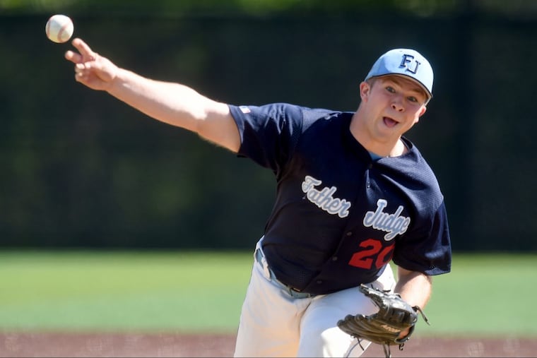 Father Judge’s Charles Kelley (#20) fires a pitch against Archbishop Carroll last season.