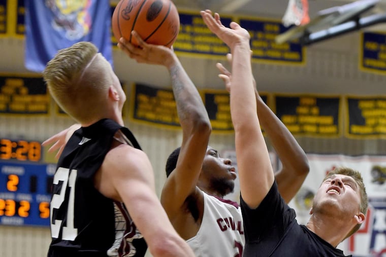 Mikeal Brown-Jones (center) helped lead Girard College to the state finals.