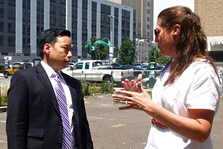 At the site are John Chin, Philadelphia Chinatown Development Corp. executive director, and Gillian Raskin of Project HOME.